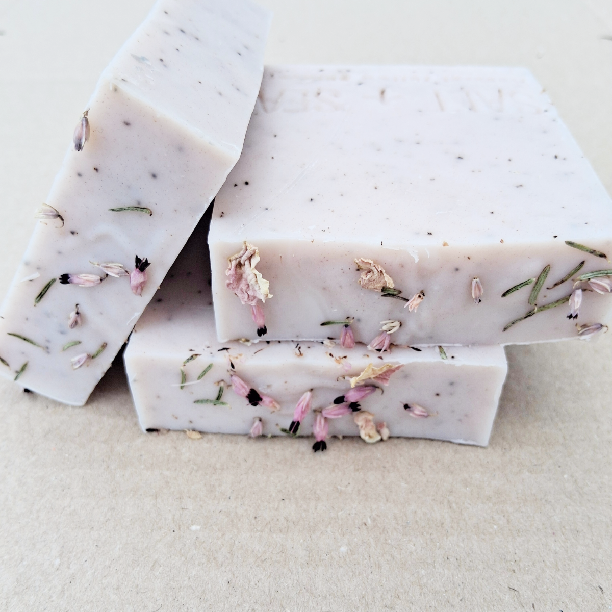 geranium and lavender tallow soap with coffee grinds and pink clay